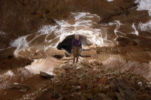 A caver in an unusual stream passage